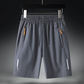 🔥50% RABATT NU!🔥  Herrars elastiska sommarshorts – Andningsbara, dragkedjefickor & stretchig passform – Perfekta för sport, resa eller varma dagar – bekväma och praktiska ☀️